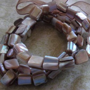 Three strand stretch oyster shell bracelet